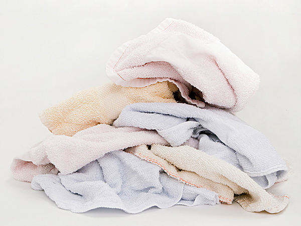 Different color hand towels on white background