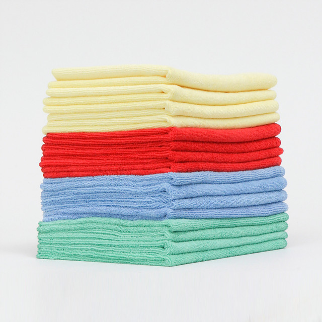 Colorful folded clothes on white background